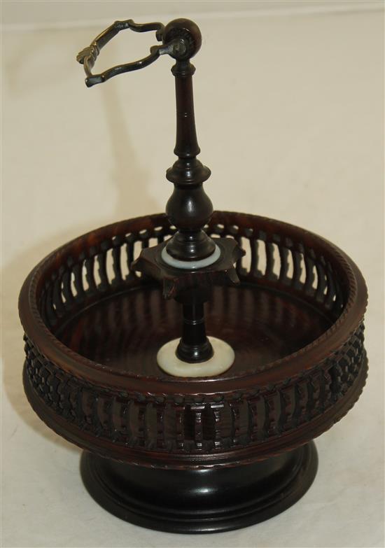 A Georgian style brass mounted turned and pierced lignum vitae cruet stand, H.9.5in.